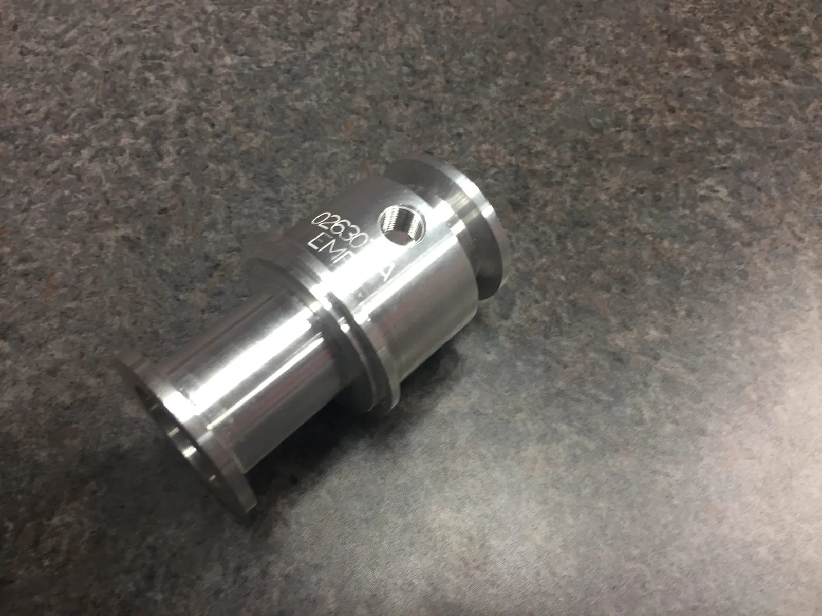Turned aluminum fitting with engraved part number